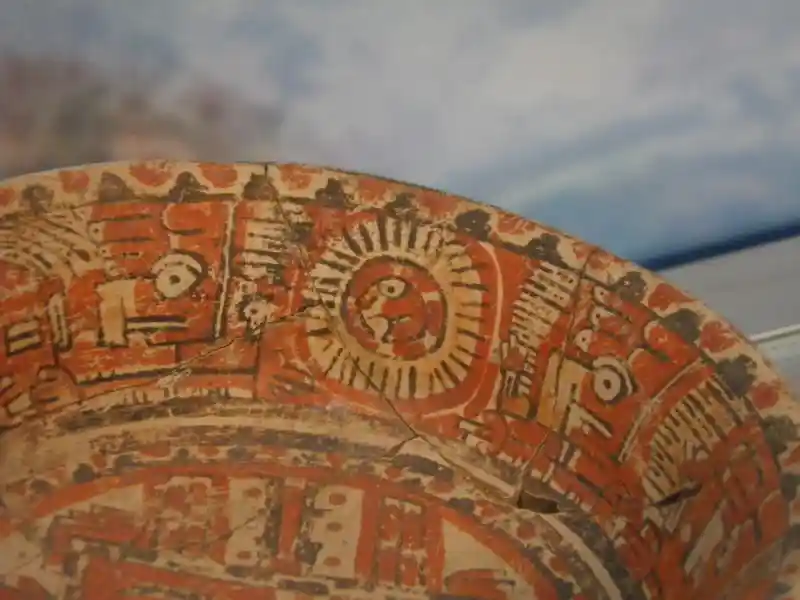 Dish, solar disc with face in the center, sun symbol